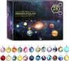 A product box for a universe and galaxy collection set, with images of planets and stars, and a display of 24 individual planet-themed charms below. Náhled obrázku produktu