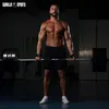 A muscular man is performing a deadlift in a gym. Produktbild-Vorschau