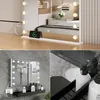 Collage of images showing a vanity mirror with LED lights, a charging phone on a shelf, and bathroom accessories. Produktbild-Vorschau