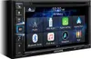A close-up, front-facing view of an Alpine INE-W611D 2-DIN car stereo system, displaying its touchscreen interface with various app icons and menu options. Produktbild-Vorschau