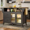 A kitchen island with various items on and inside it, set in a kitchen environment. Podgląd zdjęcia produktu