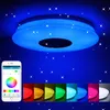 A smart LED ceiling light with a built-in Bluetooth speaker, shown in various colors and controlled by a smartphone app. Produktbild-Vorschau