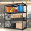 A black metal shelving unit filled with various items in a workshop or garage setting. Produktbild-Vorschau