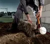 A construction worker is using a sledgehammer to adjust a stone block on a construction site. Náhľad obrázku produktu