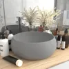 A bathroom sink and countertop with various toiletries and decorative items. Produktbild-Vorschau