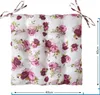 A square seat cushion with a floral rose pattern, shown flat against a white background. It has ties at two corners. Náhľad obrázku produktu