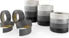 Several rolls of self-adhesive PVC trim in different shades of gray and white, some partially unrolled. Anteprima dell’immagine prodotto