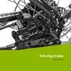 A close-up view of the rear brake and gear mechanism of a bicycle, with green overlay text at the bottom. Produktbild-Vorschau