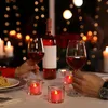 A romantic dinner setting with wine, food, and LED candles. Produktbild-Vorschau