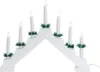 A white electric candle bridge with seven LED lights, decorated with green foliage. Podgląd zdjęcia produktu