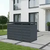 A dark gray, three-door trash bin enclosure is shown in front of a modern white house with a paved patio and lawn. Produktbild-Vorschau