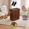 A collage of images showcasing the versatility of a bamboo laundry basket, with smaller circular images depicting socks, folded blankets, folded clothes, books, and game pieces. Produktbild-Vorschau