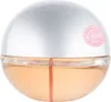 A close-up studio shot of a round perfume bottle with a silver cap and peach-colored liquid. Podgląd zdjęcia produktu