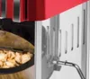 A close-up shot of a popcorn maker, showing the interior with popcorn and the exterior details. Náhled obrázku produktu