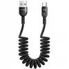 A coiled USB-C charging cable with USB-A and USB-C connectors. Anteprima dell’immagine prodotto