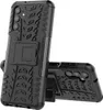 A black phone case with a tire tread pattern and a kickstand is shown against a white background. Another identical case is partially visible in the foreground. Produktbild-Vorschau