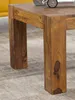 Close-up of the legs and corner of a wooden coffee table. Produktbild-Vorschau