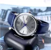 A close-up shot of a Casio watch with a blue leather strap, resting on a dark object. Voir les images du produit