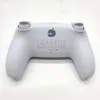 The back of a white and blue wireless game controller is shown against a white background. Produktbild-Vorschau