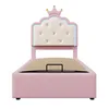 A pink upholstered bed frame with a crown-shaped headboard, illuminated by blue LED lights. Produktbild-Vorschau