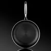A close-up studio shot of a frying pan against a dark background. Náhled obrázku produktu