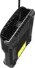 A black battery charger is shown from a diagonal angle, with a USB cable plugged into the top. Podgląd zdjęcia produktu