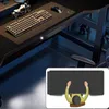 A gaming desk setup with a keyboard, mouse, and a small motorcycle figurine. An inset shows a top-down view of a person sitting at a desk. Náhled obrázku produktu