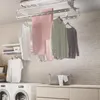 A laundry room with clothes drying on a ceiling-mounted rack. Náhľad obrázku produktu