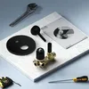 A collection of plumbing fixtures and tools laid out on a marble surface. Produktbild-Vorschau
