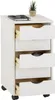 A white roll container with five drawers is shown from the front, with the top drawer and one other drawer partially open. Produktbild-Vorschau