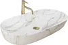 A white oval countertop sink with gold veining and a gold faucet. Podgląd zdjęcia produktu