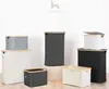 A collection of storage baskets of various sizes and colors, arranged on a light wooden floor against a white background. The brand logo 'hennez' is visible at the top. Náhľad obrázku produktu