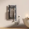 A bathroom setting with a towel warmer, bathtub, and candle. Anteprima dell’immagine prodotto
