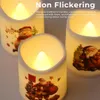 Three LED candles with Christmas-themed designs, one with a snowman and two with Santa Claus, are displayed. Produktbild-Vorschau