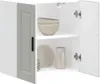 An open cabinet with dishes and bowls inside. Voir les images du produit