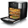 A black and silver air fryer oven with its door open, showing three racks filled with food, including a pizza on the bottom rack. Produktbild-Vorschau