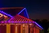 Christmas lights on a house roof at night. Podgląd zdjęcia produktu