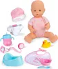 A collection of baby doll accessories and a baby doll are arranged on a white background. Produktbild-Vorschau