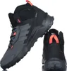 A pair of black and gray Adidas Terrex hiking boots are shown against a white background. One boot is shown from the side, and the other is shown from the back. Produktbild-Vorschau
