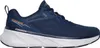 A side view of a blue Skechers sneaker with a white sole. Voir les images du produit