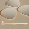 Three irregularly shaped mirrors with LED lighting are displayed against a light-colored background. A color temperature scale is shown at the bottom. Produktbild-Vorschau