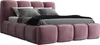A pink upholstered bed with pillows and a blanket. Produktbild-Vorschau