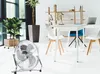 A silver floor fan is placed on a white floor in a bright, modern office space with plants and a desk in the background. Voir les images du produit