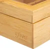 Close-up of the corner of a wooden box with a glass lid. Podgląd zdjęcia produktu