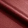 A close-up view of dark red fabric, likely upholstery for a sofa. Náhľad obrázku produktu