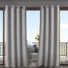 Outdoor curtains on a balcony overlooking the sea, with furniture visible behind them. Produktbild-Vorschau