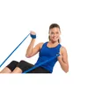 A woman is exercising with a resistance band. Produktbild-Vorschau