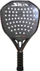 A black and orange padel racket is shown against a white background. Produktbild-Vorschau