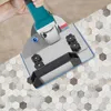 A hand is using a grinder with a special attachment to cut tiles. Náhled obrázku produktu