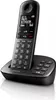 A black Philips cordless phone with its charging base, displayed against a white background. Voir les images du produit